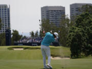 Brooks Koepka hits from the fairway on the 14th hole during a practice round for the U.S. Open Championship golf tournament at The Los Angeles Country Club on Tuesday, June 13, 2023, in Los Angeles.