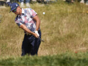 Rickie Fowler chips to the green on the fourth hole during the second round of the U.S. Open golf tournament at Los Angeles Country Club on Friday, June 16, 2023, in Los Angeles. (AP Photo/Marcio J.