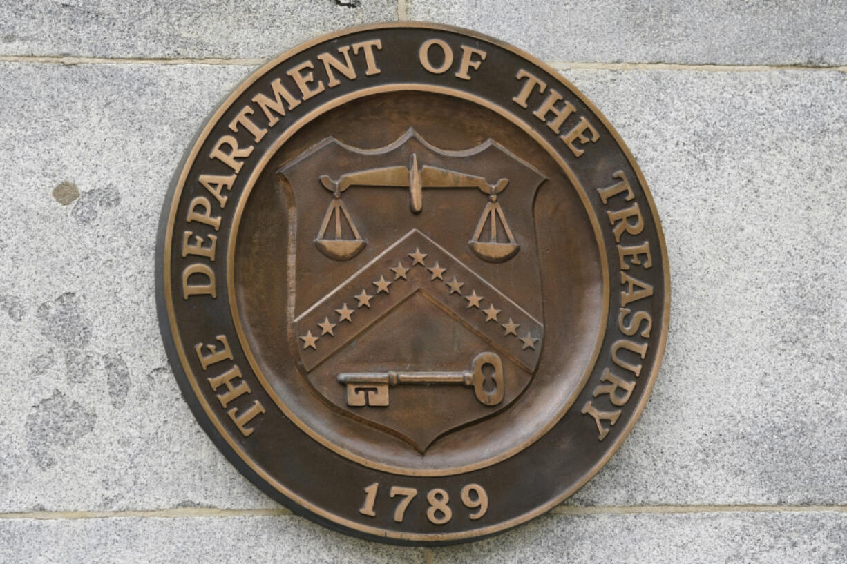 FILE - The Department of the Treasury's seal outside the Treasury Department building in Washington on May 4, 2021. The U.S. sanctioned a group of Russian-intelligence linked individuals Monday for their role in allegedly helping the Kremlin destabilize Moldova's democratically-elected government through protests in  Moldova's capitol earlier this year.