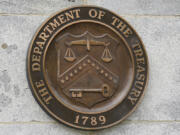 FILE - The Department of the Treasury's seal outside the Treasury Department building in Washington on May 4, 2021. The U.S. sanctioned a group of Russian-intelligence linked individuals Monday for their role in allegedly helping the Kremlin destabilize Moldova's democratically-elected government through protests in  Moldova's capitol earlier this year.