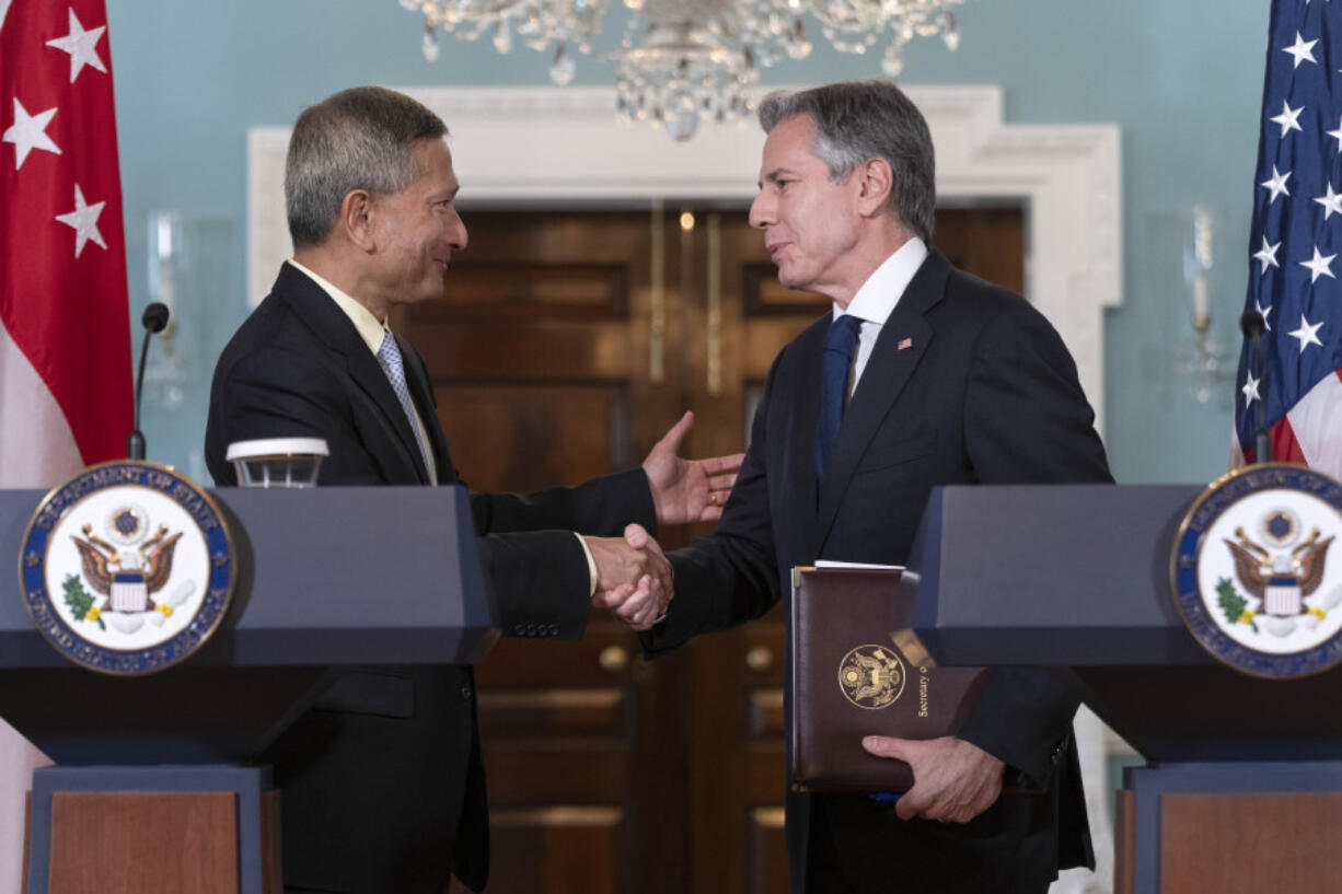 Secretary of State Antony Blinken, right, shakes hands with Singapore's Foreign Minister Vivian Balakrishnan, after a news conference at the State Department, Friday, June 16, 2023, in Washington.