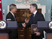 Secretary of State Antony Blinken, right, shakes hands with Singapore's Foreign Minister Vivian Balakrishnan, after a news conference at the State Department, Friday, June 16, 2023, in Washington.