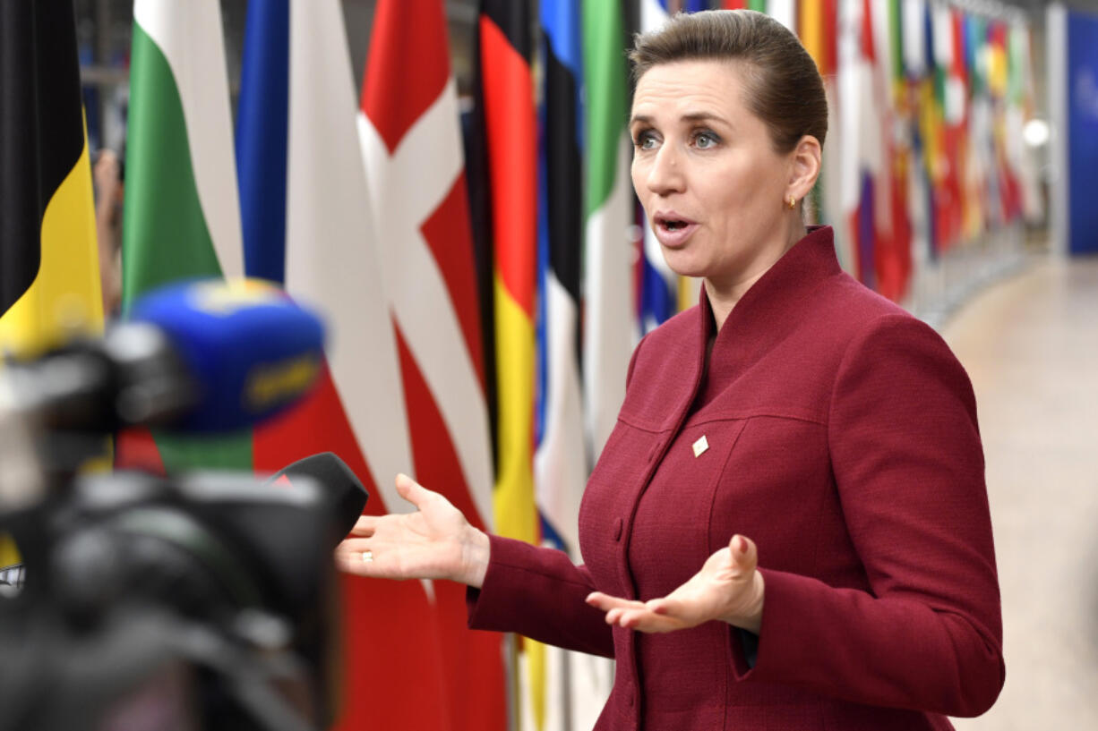 FILE - Denmark's Prime Minister Mette Frederiksen speaks with the media as she arrives for an EU summit at the European Council building in Brussels, March 23, 2023. President Joe Biden is welcoming Denmark and Britain's prime ministers this week to Washington for talks that will focus heavily on what lays ahead in the war in Ukraine -- including the recently launched effort to train, and eventually equip, Ukraine with American-made F-16s fighter jets.