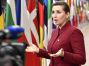 FILE - Denmark's Prime Minister Mette Frederiksen speaks with the media as she arrives for an EU summit at the European Council building in Brussels, March 23, 2023. President Joe Biden is welcoming Denmark and Britain's prime ministers this week to Washington for talks that will focus heavily on what lays ahead in the war in Ukraine -- including the recently launched effort to train, and eventually equip, Ukraine with American-made F-16s fighter jets.