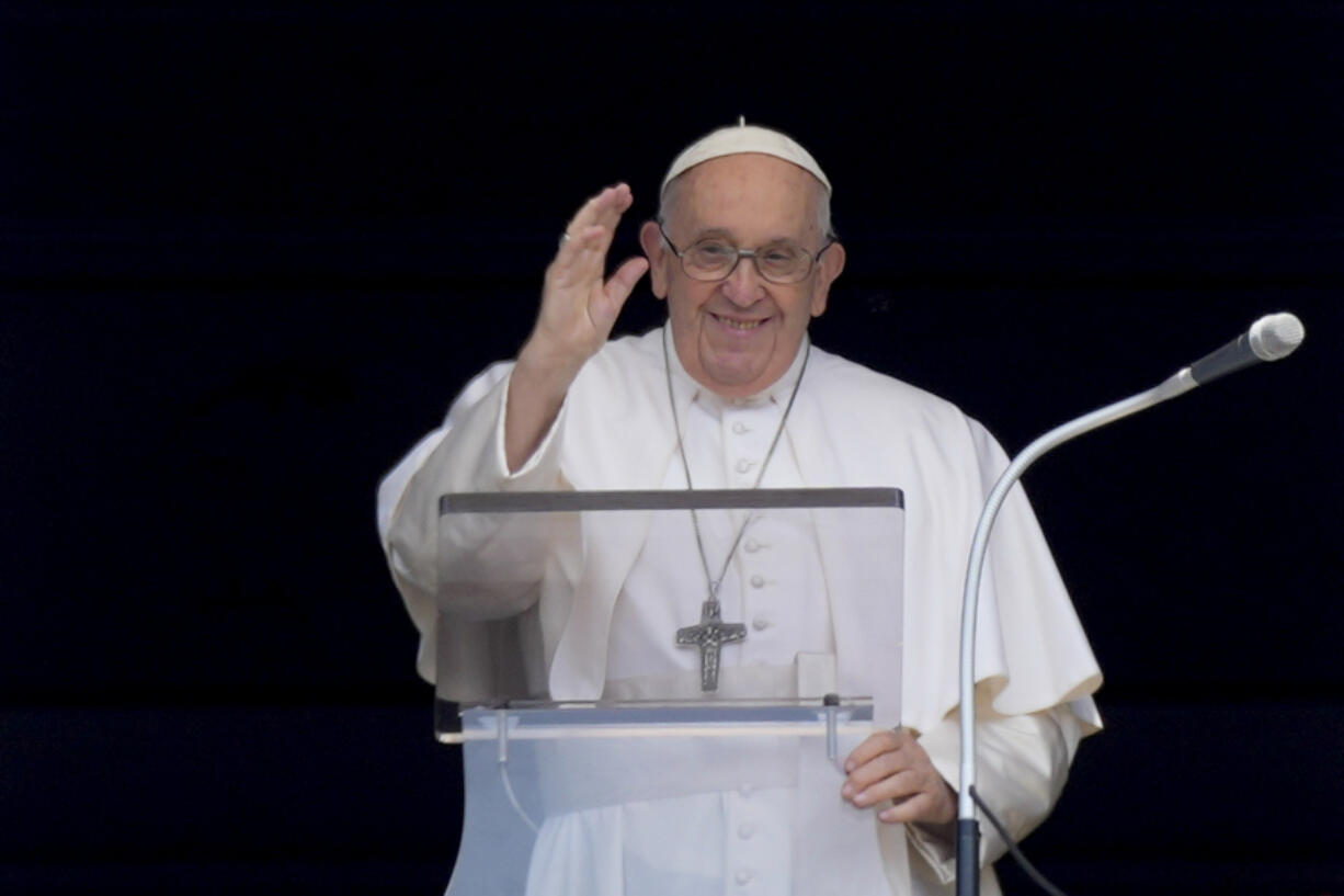 Pope Francis delivers his blessing as he recites the Angelus noon prayer from the window of his studio overlooking St.Peter's Square, at the Vatican, Sunday, June 18, 2023.