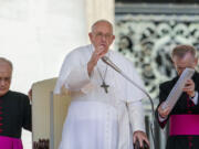 Pope Francis blesses the faithful at the end of his weekly general audience in St. Peter's Square at The Vatican, Wednesday, June 7, 2023.