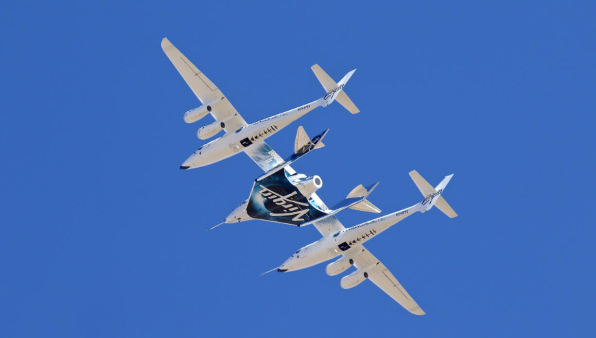 FILE - Virgin Galactic's VSS Unity departs Mojave Air & Space Port in Mojave, Calif., for the final time as Virgin Galactic shifts its SpaceFlight operations to New Mexico, Feb. 13, 2020. Virgin Galactic announced Wednesday, June 14, 2023, that monthly commercial flights to the edge of space will begin for ticket-holders in August, following a research flight planned for the end of June.