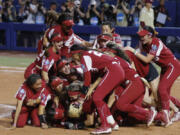 Oklahoma players celebrate after defeating Florida State in the NCAA Women's College World Series softball championship series Thursday, June 8, 2023, in Oklahoma City.