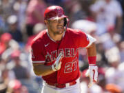 Los Angeles Angels' Mike Trout (27) runs on a single during the seventh inning of a baseball game against the Chicago White Sox in Anaheim, Calif., Thursday, June 29, 2023.