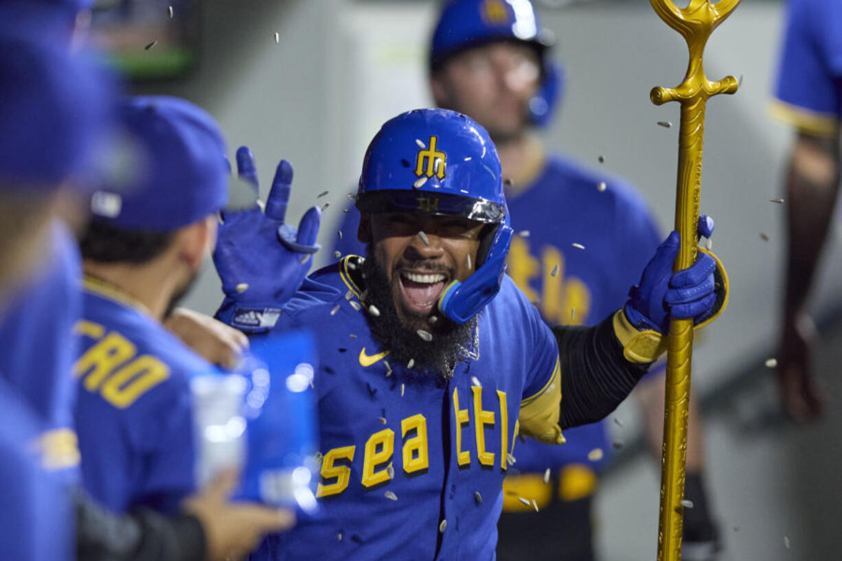 Seattle Mariners' Teoscar Hernandez celebrates his solo home run off Chicago White Sox relief pitcher Tanner Banks during the seventh inning of a baseball game Friday, June 16, 2023, in Seattle.