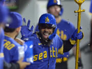 Seattle Mariners' Teoscar Hernandez celebrates his solo home run off Chicago White Sox relief pitcher Tanner Banks during the seventh inning of a baseball game Friday, June 16, 2023, in Seattle.