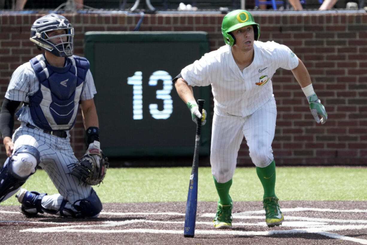 Oregon's Drew Cowley doubles against Xavier and drives in the winning run in the seventh inning during an NCAA regional college tournament baseball game on Friday June 2, 2023, in Nashville, Tenn. Oregon won 5-4.