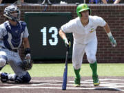 Oregon's Drew Cowley doubles against Xavier and drives in the winning run in the seventh inning during an NCAA regional college tournament baseball game on Friday June 2, 2023, in Nashville, Tenn. Oregon won 5-4.