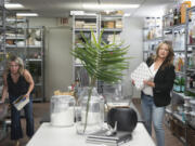 Lead designer Stacy Johnson, left, and owner Laurie Fleming collect pieces to stage a kitchen for a client June 5 at Fleming's home staging company Fix Design Haus in Plymouth, Minn.