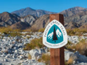 A Pacific Crest Trail sign for hikers and backpackers.