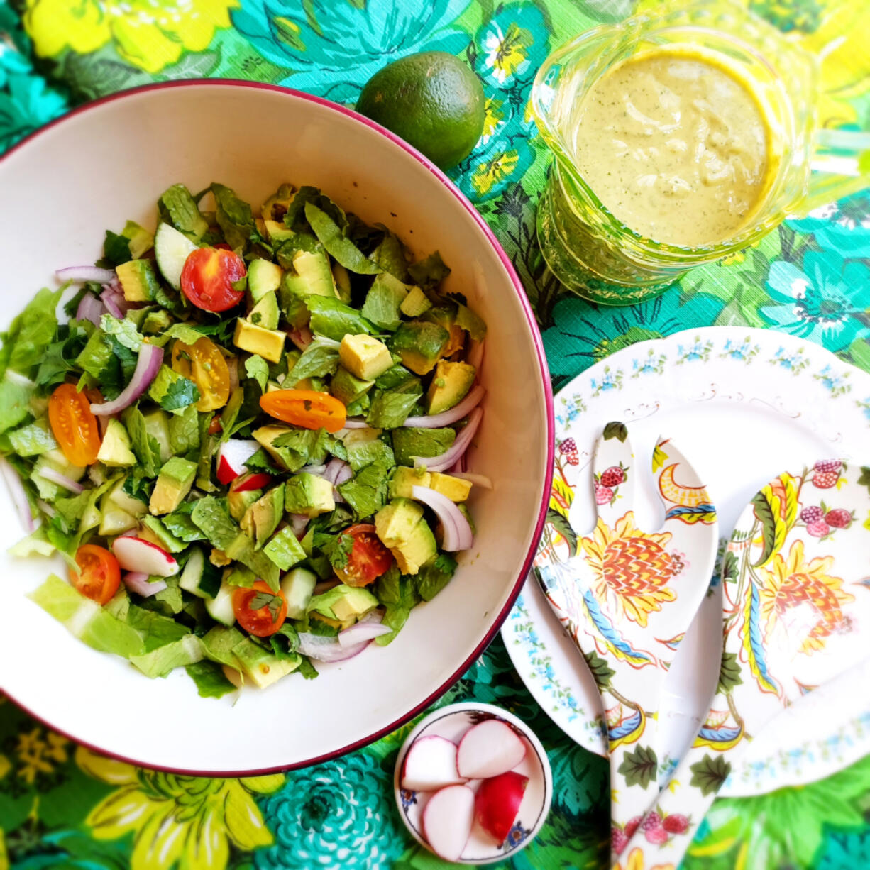 This piquant summer salad blends crunchy fresh veggies with creamy avocado and a tangy avocado dressing.