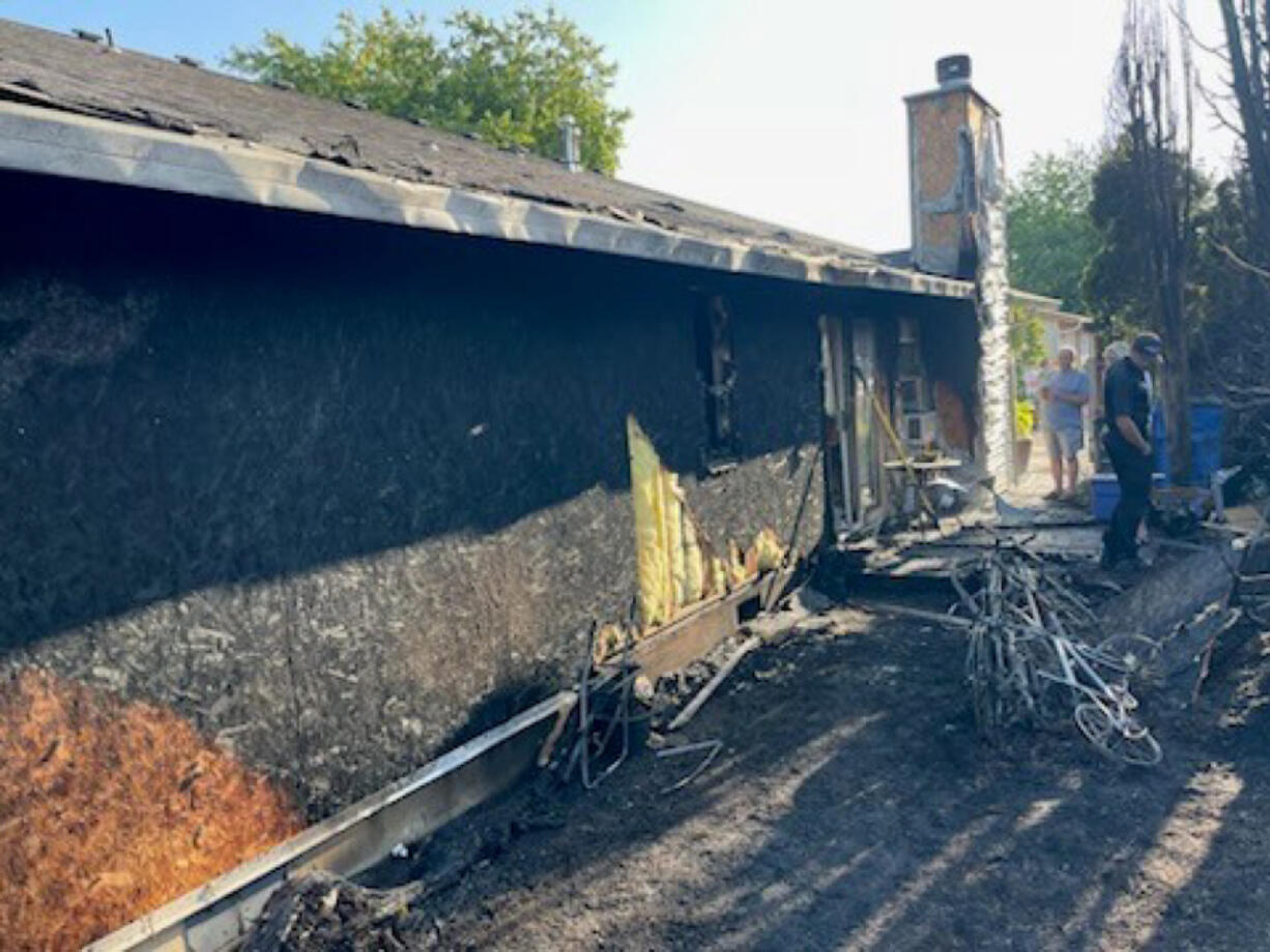 A duplex at 725 Southeast 135th Court was heavily damaged by an early evening fire Monday. The residents of the home escaped without injury.