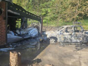 The remnants of a house fire that sparked early Wednesday morning in the 22000 block of Northeast WH Garner Road near Yacolt. Homeowner Ashley Kesler said the house was a total loss, along with the family's two vehicles, dirt bikes and other belongings.