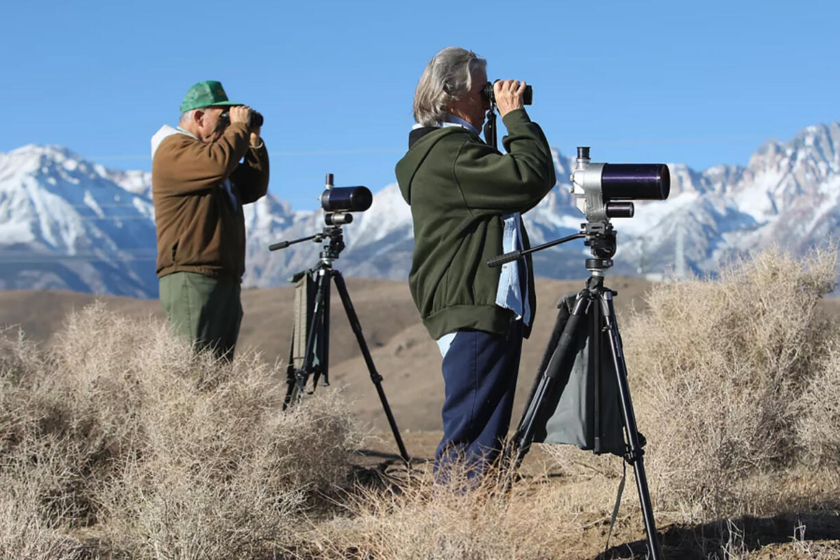 Big Pine, California residents Tom and Joanne Heindel scan for birds from an overlook at Tinemaha Reservoir in the Owens Valley in 2009.