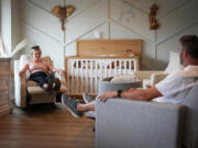 Andrew and Katie Beiswenger, who are 20 weeks along with their first daughter, test out rocking chairs at Baby Grand in St. Louis Park, Minnesota, on June 28, 2023. (Shari L.