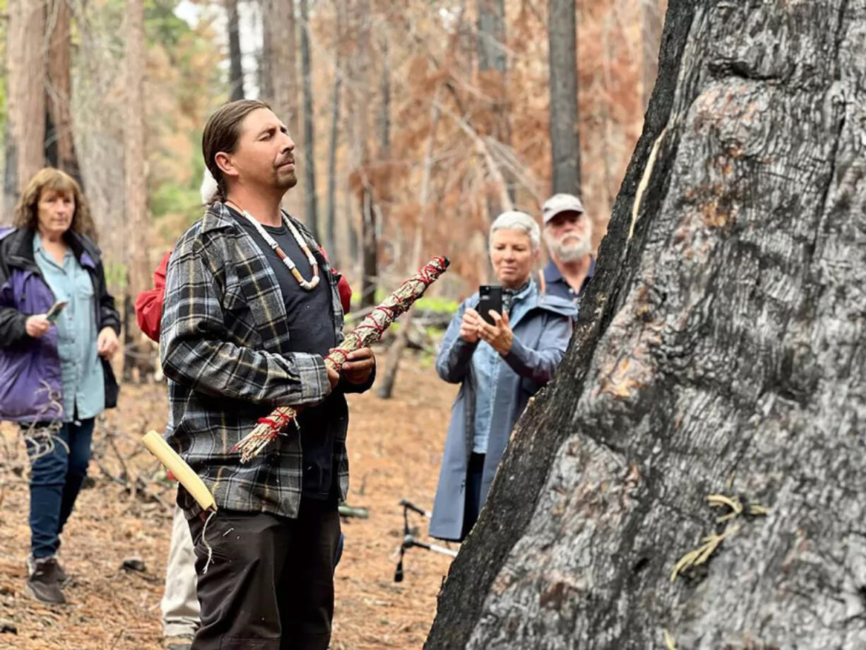 Leader of the Calaveras band of Mi-Wuk Indians Adam Lewis sang Native songs and prayed for ???the Orphans??? at Calaveras Big Trees State Park in June.