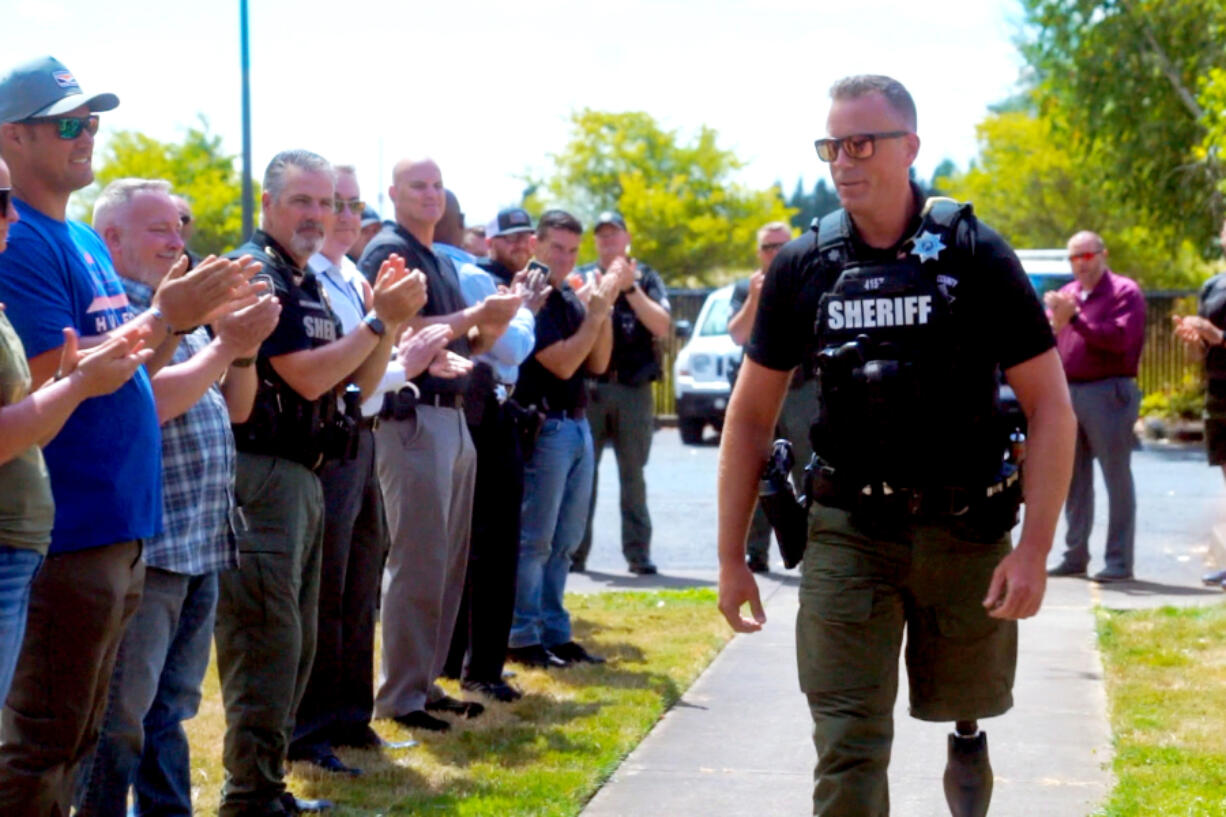 Clark County sheriff's Deputy Drew Kennison returns to work Tuesday, five months after he was injured when his SUV was crushed Feb. 22 by a portion of a snow-heavy tree in Skamania County.