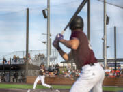 Raptors designated hitter Andy Allanson, left, swings at a pitch Tuesday, June 27, 2023, during the Raptors? game against Bend at the Ridgefield Outdoor Recreation Complex.
