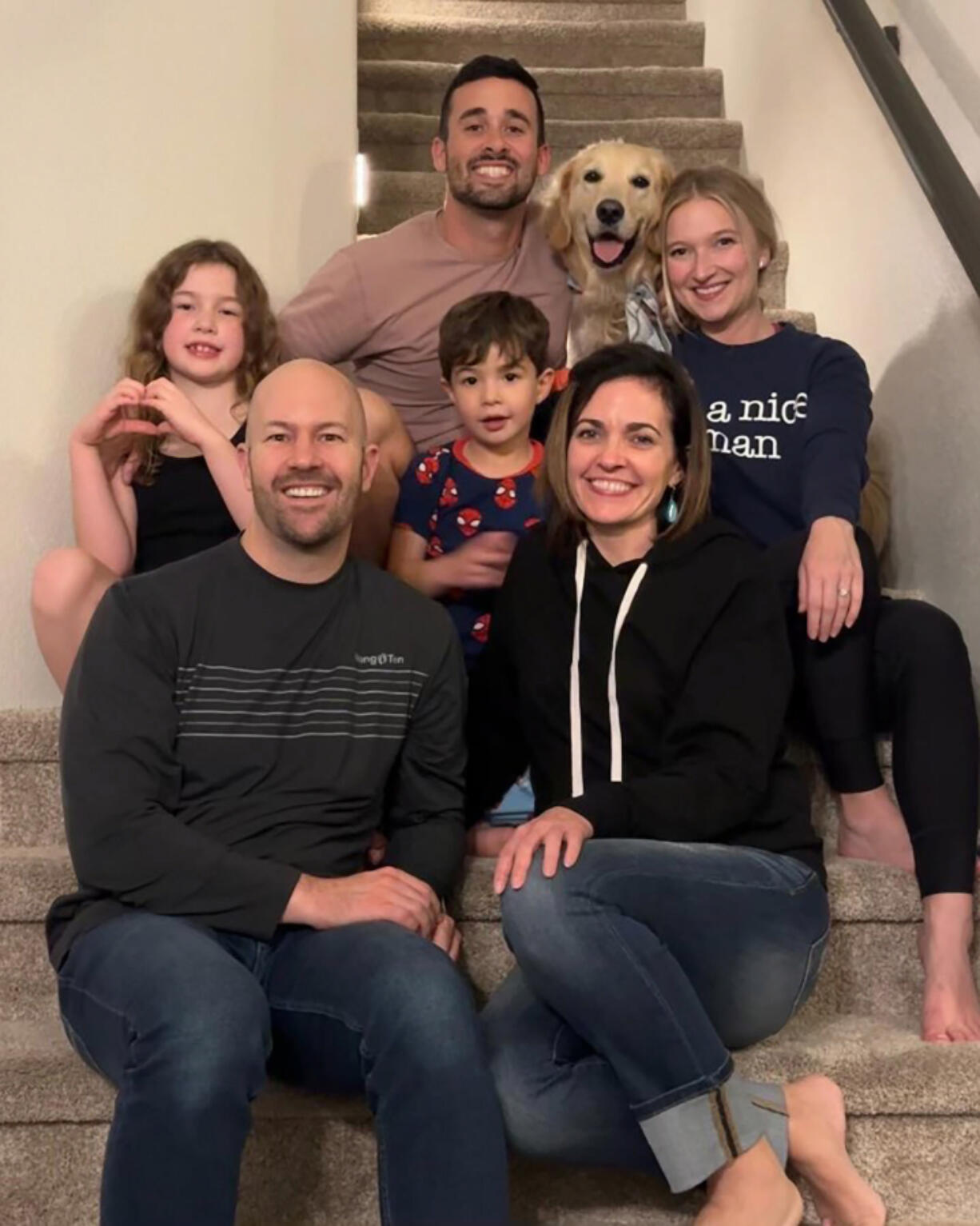 2011 Washougal High School graduate Jesse Revesz (top center) and former Washougal High counselor Christina Mackey-Greene (bottom right) gather with their families earlier this year.