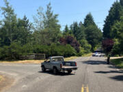 The scene of a Tuesday crash after Clark County sheriff's deputies say a pickup struck a bicyclist on Northwest 291st Street. Investigators arrested the driver of the pickup, a 60-year-old Ridgefield man, on suspicion of vehicular assault.