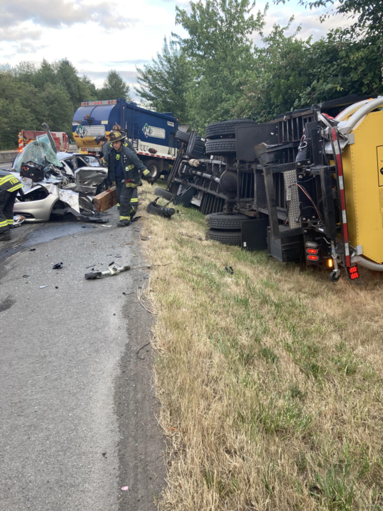 A four-vehicle crash Tuesday morning on Northeast Padden Parkway near 94th Avenue. A Waste Connections garbage truck changed lanes to avoid a flagger in the road and struck the Dodge Dart next to it.