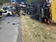 A four-vehicle crash Tuesday morning on Northeast Padden Parkway near 94th Avenue. A Waste Connections garbage truck changed lanes to avoid a flagger in the road and struck the Dodge Dart next to it.