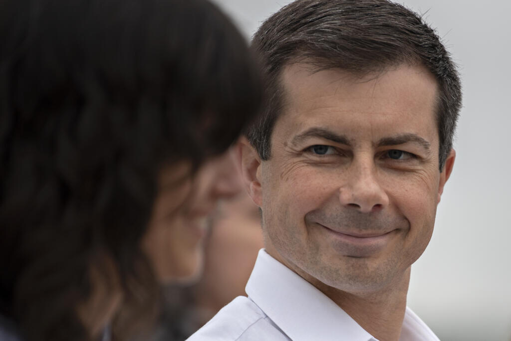 U.S. Rep. Marie Gluesenkamp Perez, left, shares a moment with U.S. Secretary of Transportation Pete Buttigieg at the Port of Camas-Washougal on Friday morning, July 7, 2023.