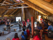 Chinook Indian Nation Vice Chair Sam Robinson, from left, Cowlitz Indian Tribe spiritual leader Tanna Engdahl, Cowlitz Indian Tribe Council Chair Patty Kinswa-Gaiser and Mildred Robinson lead campers in song during Camp Confluence at the Cathlapotle Plankhouse in the Ridgefield National Wildlife Refuge.