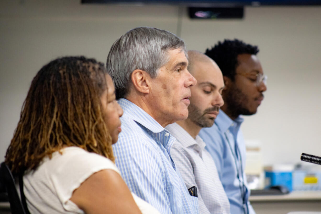 Carol Collier, Roy Johnson, Andy Silver, and Victor Caesar of the Vancouver Housing Authority share updates on their organization's findings at the affordable housing workshop on July 26. Johnson announced his retirement on Monday, to be succeeded by Silver.