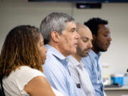 Carol Collier, Roy Johnson, Andy Silver, and Victor Caesar of the Vancouver Housing Authority share updates on their organization's findings at the affordable housing workshop on July 26. Johnson announced his retirement on Monday, to be succeeded by Silver.