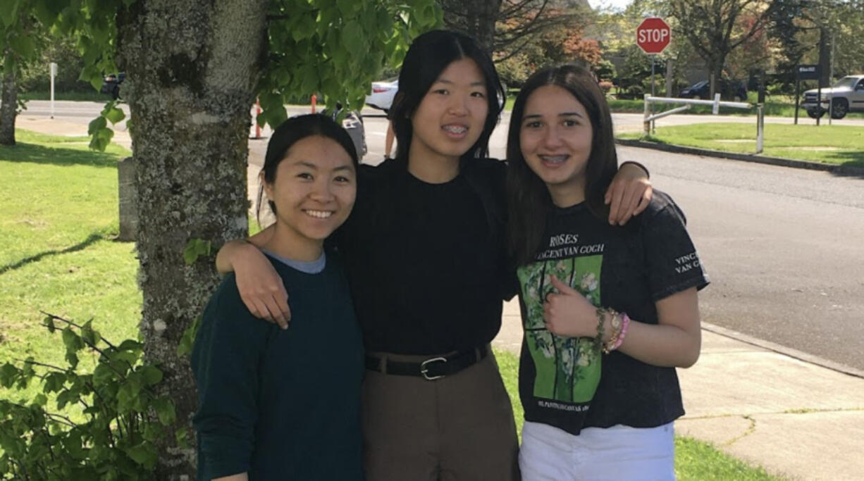 Camas High School sophomores, from left, Florence Liang, Sophie Zhang and Zaina Hwejj founded STEM Scholars, a student-run online tutoring organization. The trio hoped to foster student engagement online to take part in research projects and offer advice to curious young students.