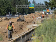 A project to widen state Highway 14 to three lanes in each direction between Interstate 205 and Southeast 164th Avenue is under construction with completion due next year.