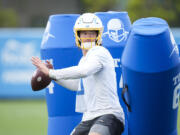 Los Angeles Chargers quarterback Justin Herbert (10) runs a drill during the NFL football team's camp in Costa Mesa, Calif., Tuesday, June 13, 2023. (AP Photo/Jae C.