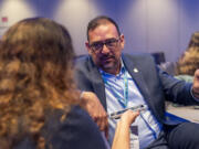 Arizona Secretary of State Adrian Fontes, right, attends the summer meeting of the National Association of Secretaries of State, Tuesday, July 11, 2023, in Washington. Efforts to deceive the public about voting and elections remain a top concern for state election officials as they dig into preparations for the 2024 election.