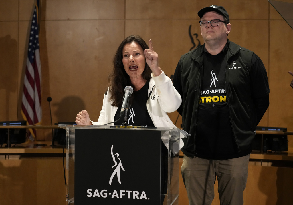 SAG-AFTRA president Fran Drescher, left, and SAG-AFTRA National Executive Director and Chief Negotiator Duncan Crabtree-Ireland speak during a press conference announcing a strike by The Screen Actors Guild-American Federation of Television and Radio Artists on Thursday, July, 13, 2023, in Los Angeles. This marks the first time since 1960 that actors and writers will picket film and television productions at the same time.