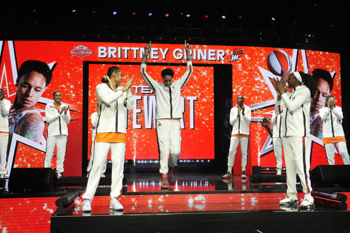 Phoenix Mercury's Brittney Griner, of Team Stewart, center, reacts as she is introduced before a WNBA All-Star basketball game Saturday, July 15, 2023, in Las Vegas.