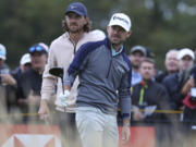 United States' Brian Harman, right and England's Tommy Fleetwood look down the 14th hole from the tee during the third day of the British Open Golf Championships at the Royal Liverpool Golf Club in Hoylake, England, Saturday, July 22, 2023.