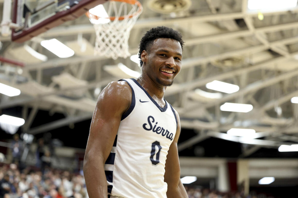 Bronny James, son of NBA superstar LeBron James, was hospitalized after going into cardiac arrest while participating in a practice at USC on Monday, July 24, 2023.