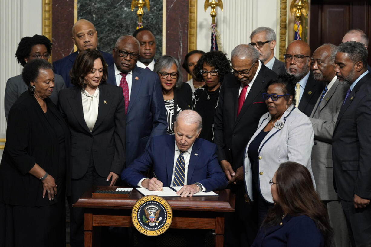 President Joe Biden signs a proclamation to establish the Emmett Till and Mamie Till-Mobley National Monument, in the Indian Treaty Room on the White House campus, Tuesday, July 25, 2023, in Washington.