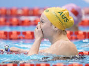 Mollie O'Callaghan of Australia reacts after winning the women's 200m freestyle swimming final at the World Swimming Championships in Fukuoka, Japan, Wednesday, July 26, 2023.