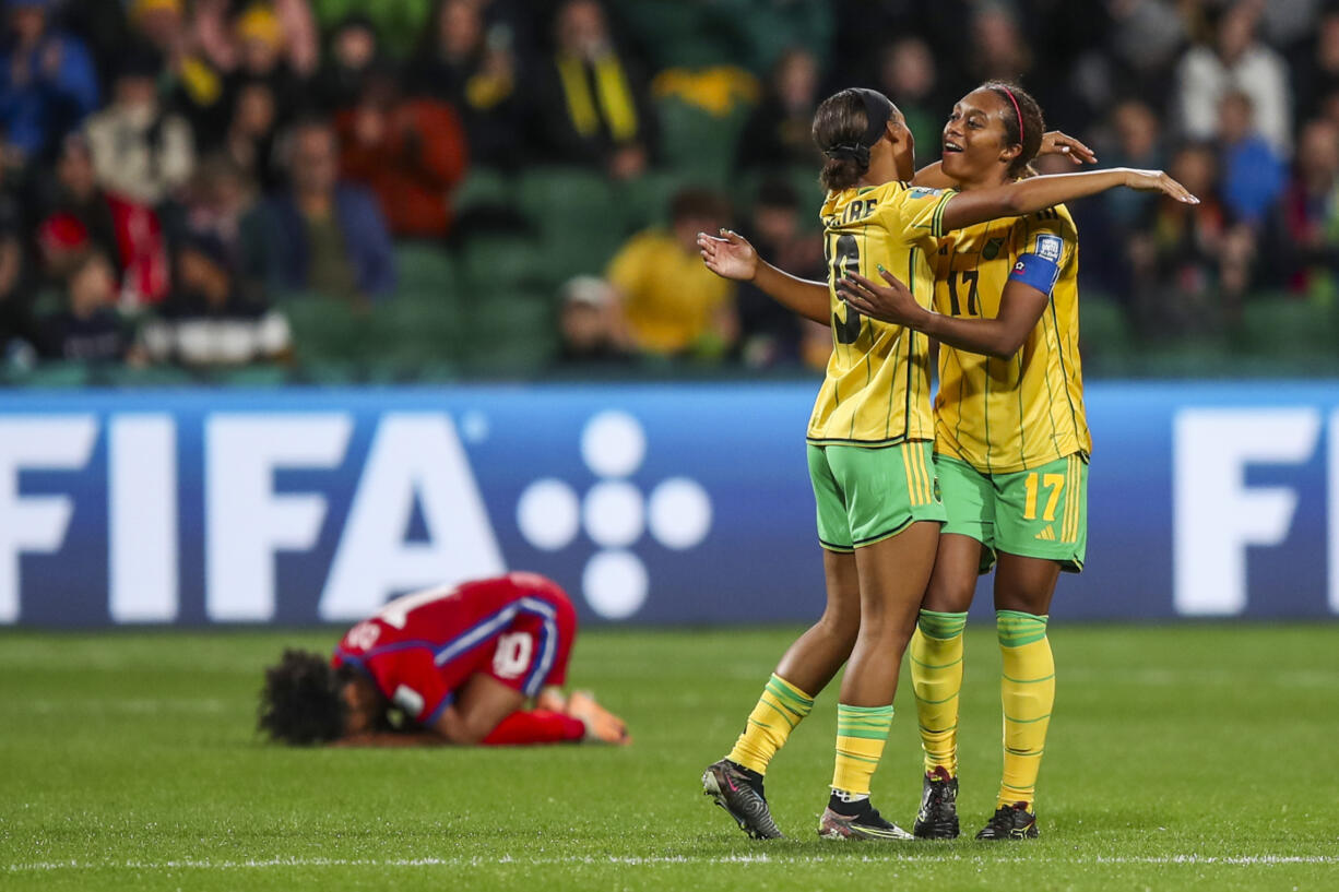 Jamaica's Allyson Swaby, right, and Tiernny Wiltshire celebrate at the end of the Women's World Cup Group F soccer match between Panama and Jamaica in Perth, Australia, Saturday, July 29, 2023. Jamaica won 1-0.