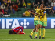 Jamaica's Allyson Swaby, right, and Tiernny Wiltshire celebrate at the end of the Women's World Cup Group F soccer match between Panama and Jamaica in Perth, Australia, Saturday, July 29, 2023. Jamaica won 1-0.