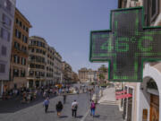 A Pharmacy shop sign displays the outside temperature of 46 Celsius degrees (114.8 F) in downtown Rome, Tuesday, July 18, 2023. Temperatures in Italy are officially registered only by the Italian Air Force's weather service while high temperatures picked by private stations need to be verified by the World Meteorological Organization, which only Monday accepted a new temperature record for continental Europe of 48.8 Celsius degrees (119.8 F), measured in Sicily on Aug. 11, 2021.