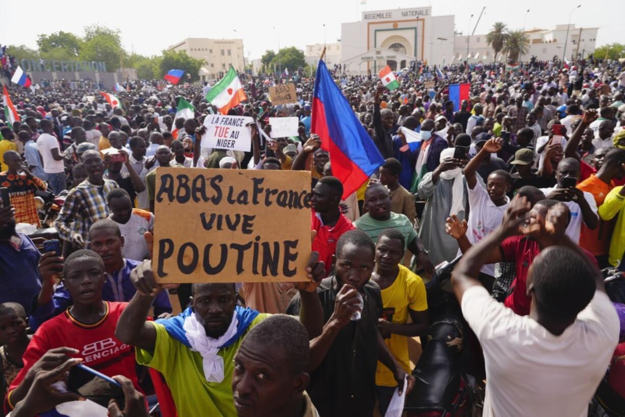 Nigeriens participate in a march called by supporters of coup leader Gen. Abdourahmane Tchiani in Niamey, Niger, Sunday, July 30, 2023. Days after mutinous soldiers ousted Niger's democratically elected president, uncertainty is mounting about the country's future and some are calling out the junta's reasons for seizing control.