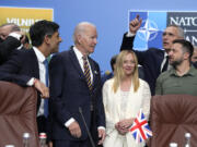 FILE - From left, Lithuania's President Gitanas Nauseda, British Prime Minister Rishi Sunak, President Joe Biden, Italy's Prime Minister Giorgia Meloni, NATO Secretary General Jens Stoltenberg and Ukraine's President Volodymyr Zelenskyy pose during a meeting of the NATO-Ukraine Council during a NATO summit in Vilnius, Lithuania, July 12, 2023. Biden is set to welcome Meloni to White House for talks.